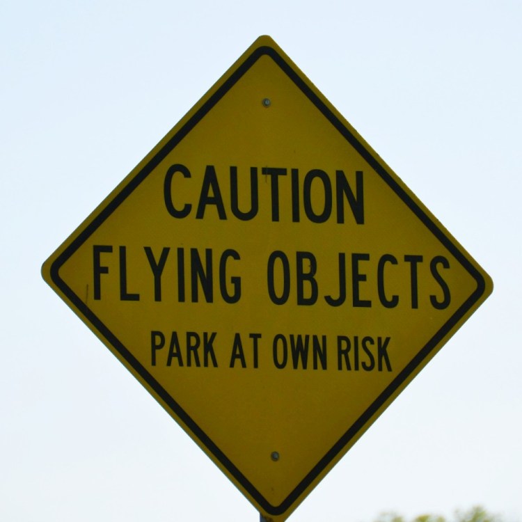 "Caution Flying Objects" sign