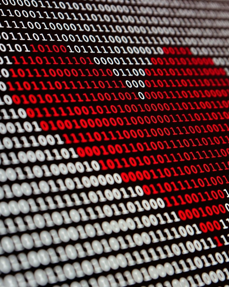 Heart over top of binary code