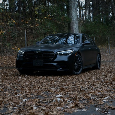 Luxury car surrounded by fallen leaves