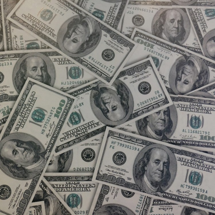 Pile of hundred dollar bills