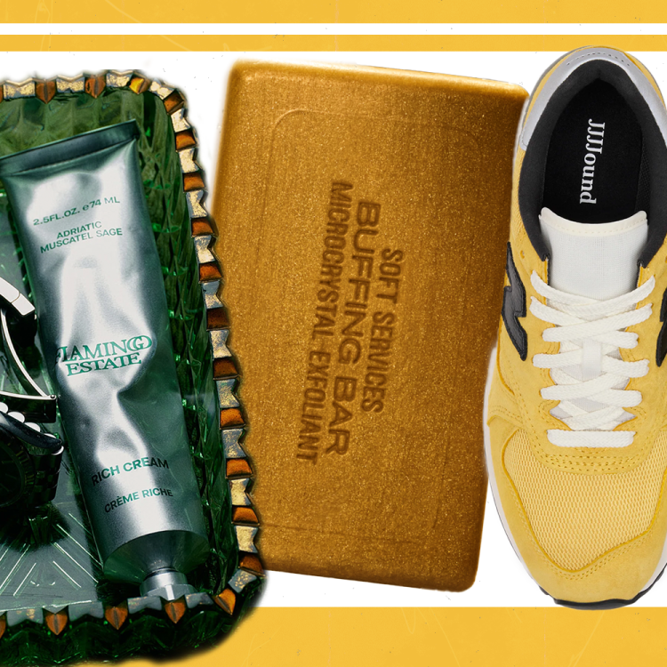 A glass tray with handcream on it, a golden bar of soap and yellow sneakers on a white and yellow background.