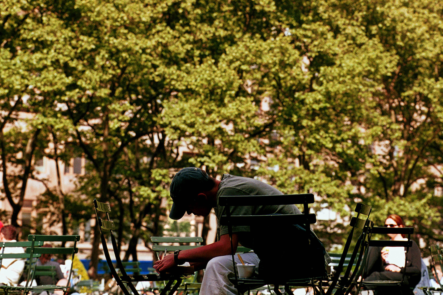 A man writing in the park