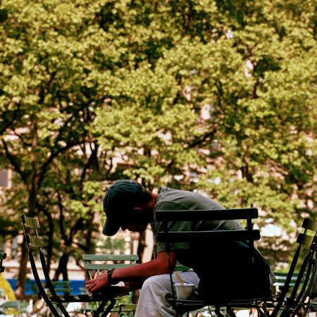 A man writing in the park