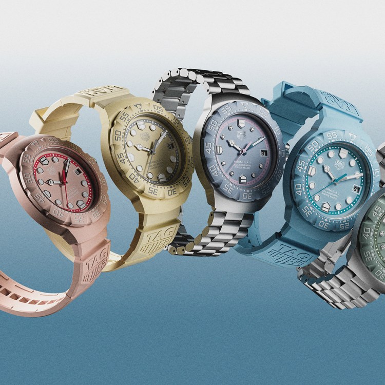 Five watches floating in the air in the colors pink, yellow, blue and green with a background that fades from white to blue