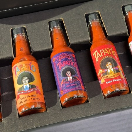 A box of bottles of Tapatio hot sauce