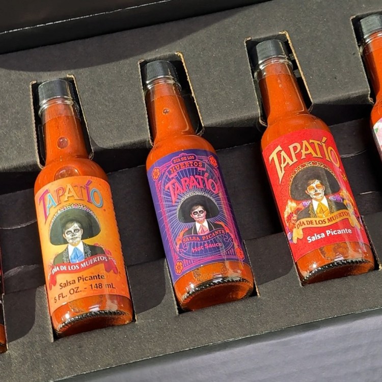 A box of bottles of Tapatio hot sauce