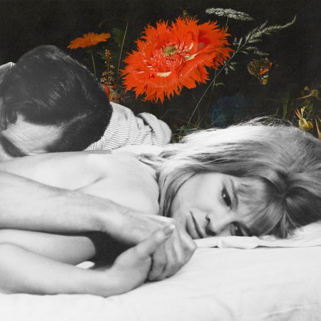 A man and woman lying in bed.