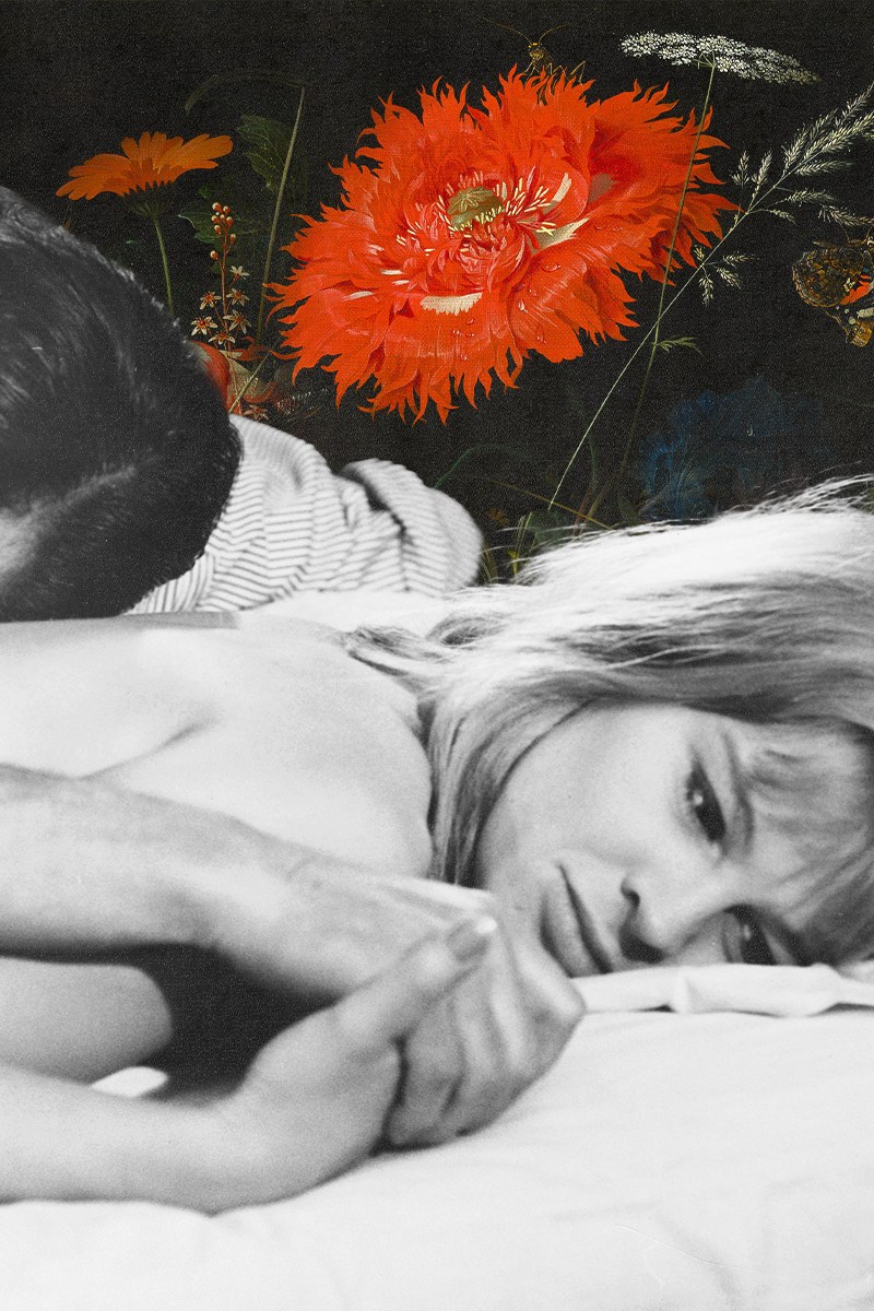 A man and woman lying in bed.