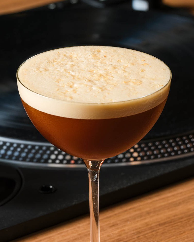 Espresso Martini in front of a DJ record deck