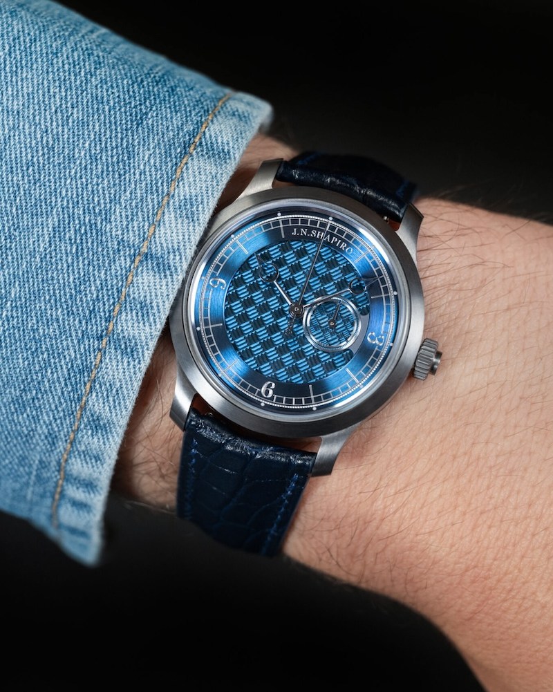 a model wearing a blue face J.N. Shapiro watch