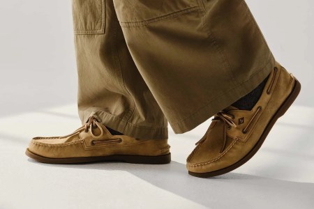 a model in a pair of tan pants and Sperry boat shoes
