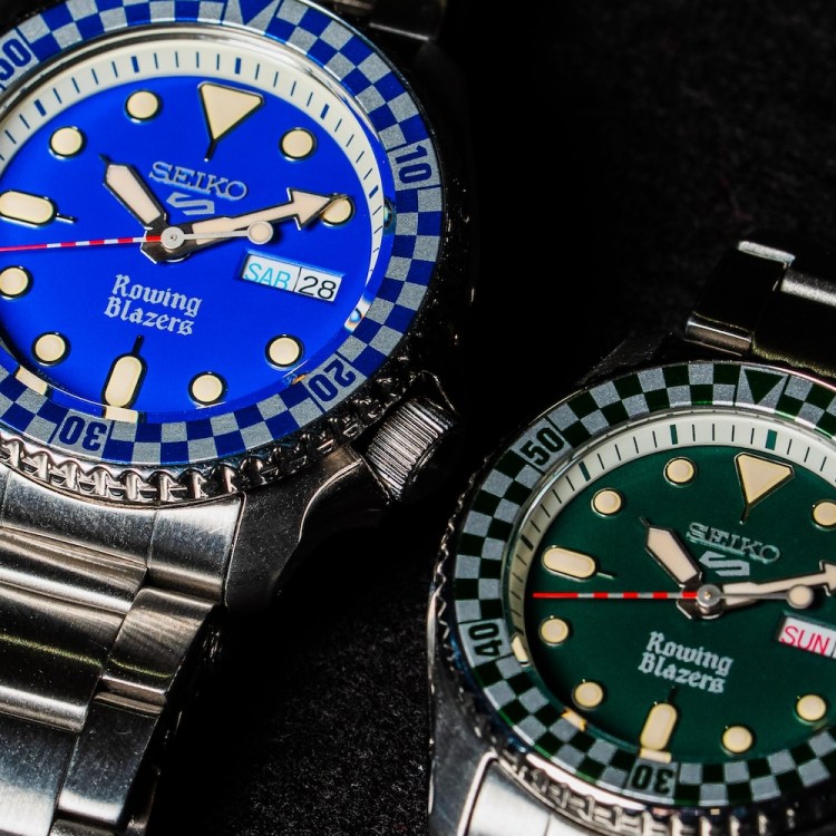 a close up of two Seiko x Rowing Blazers watches with blue and green dials on steel bracelets