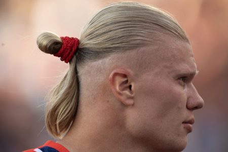 The profile of Norwegian soccer star Erling Haaland with a man bun