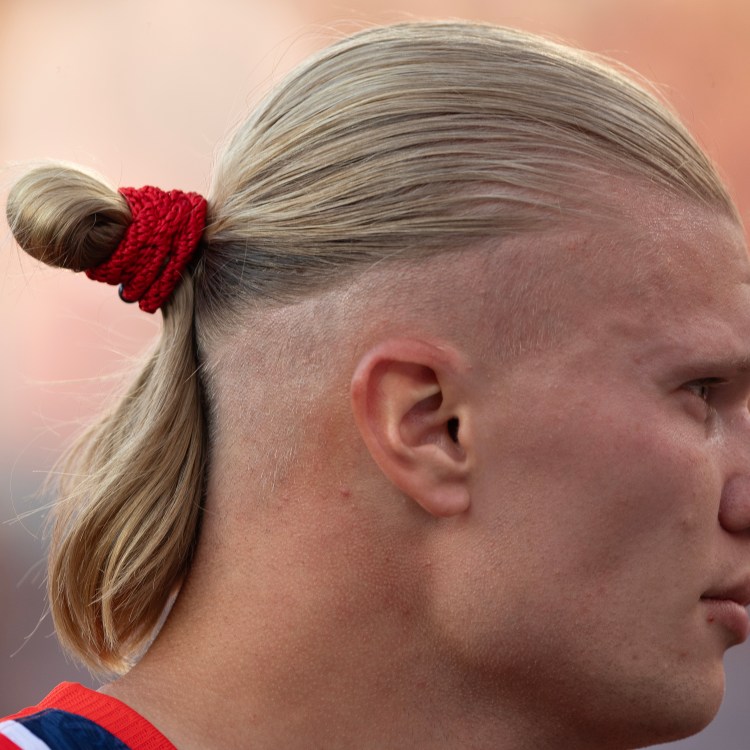 The profile of Norwegian soccer star Erling Haaland with a man bun