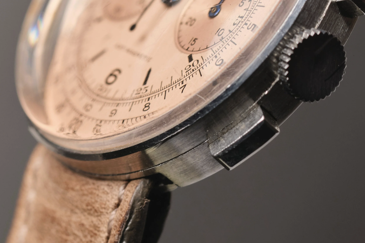 a salmon dial chronograph watch on leather strap