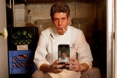 Anthony Bourdain taking a selfie with a cigarette in his mouth