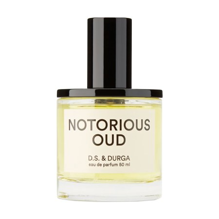 A clear glass bottle of "Notorious Oud" perfume by D.S. & Durga, with a black cap, against a white background.