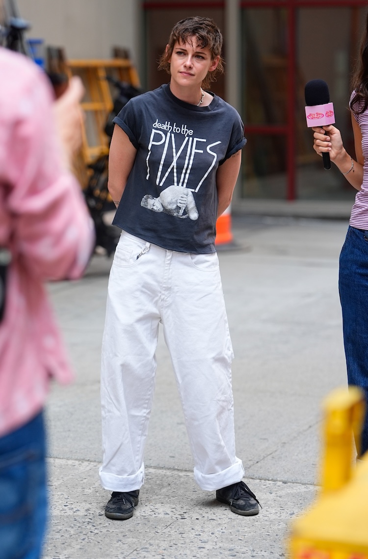 a photo of Kristen Stewart in a black tee shirt and white pants