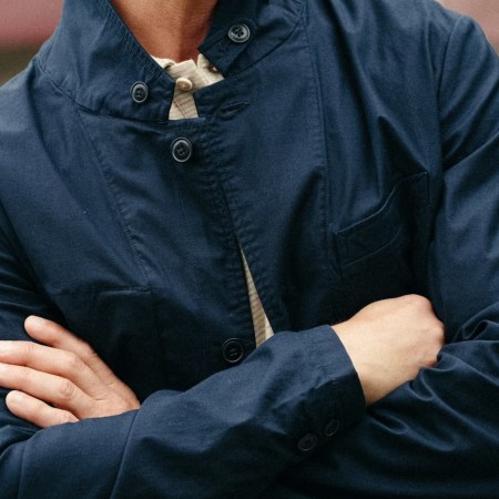the body of a model wearing a navy jacket