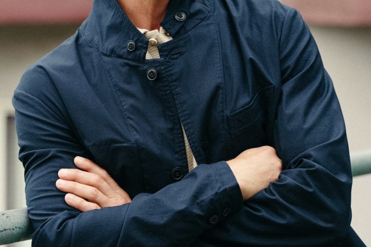 the body of a model wearing a navy jacket