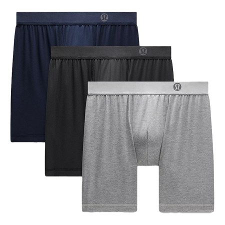 Three pairs of Lululemon boxer briefs in navy, black, and gray, stacked diagonally with waistbands visible.