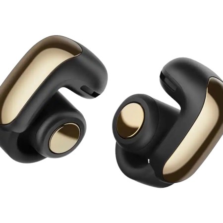 Pair of black and gold wireless earbuds with a sleek, modern design.