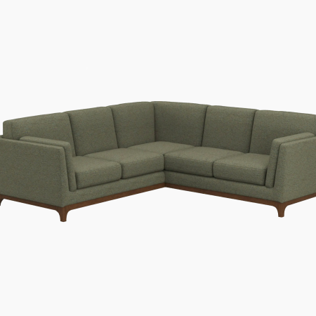 Green sectional sofa with a wooden base and legs, against a white background.