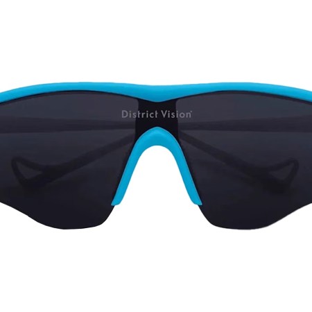 District Vision sunglasses with a bright blue frame and dark lenses, isolated on a white background.