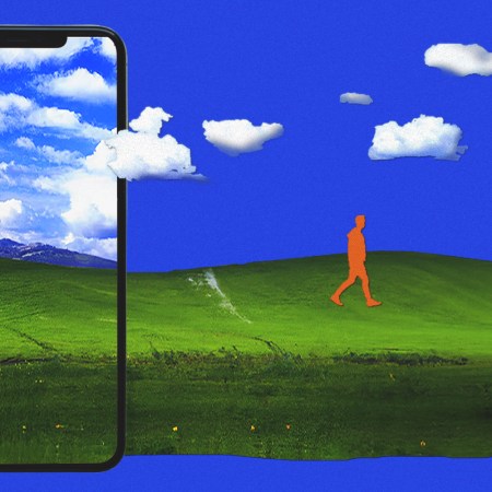 A phone displays a vibrant green hill and blue sky. Outside the phone, the scene continues with a walking orange figure.