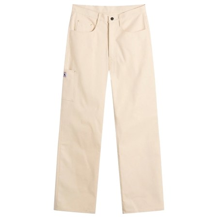 Cream-colored work pants with a small utility pocket on the left thigh and a black button at the waist.