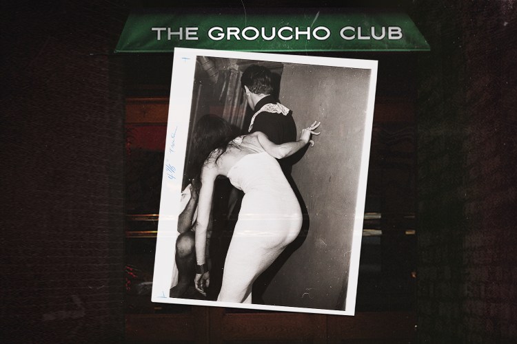 Black and white photo of a woman in a white dress peering around a corner with a man, set against a dark background with "THE GROUCHO CLUB" banner.