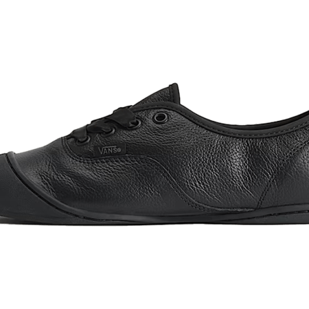 A black leather Vans sneaker with black laces, a black rubber toe cap, and a black Vans logo on the side.
