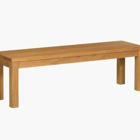 Light brown wooden bench with a smooth top and four sturdy legs, against a white background.