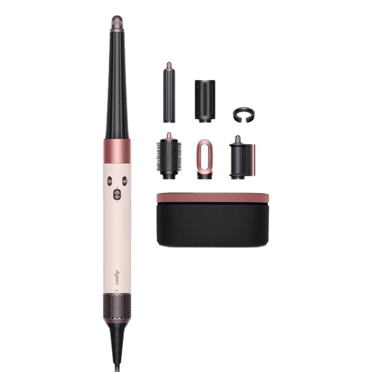 Dyson Airwrap multi-styler in blush pink and black, with various attachments and a storage case.