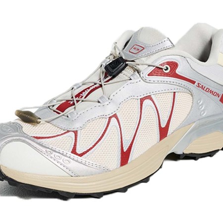 Salomon XT-6 sneaker in white mesh with silver and red accents, black sole, and beige midsole.