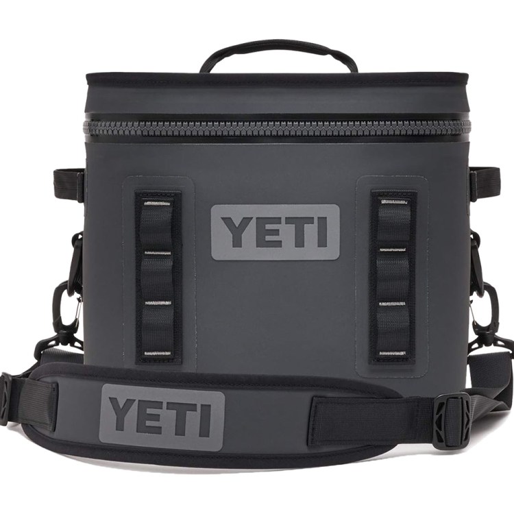 A dark gray Yeti Hopper Flip 12 soft cooler with a top handle and shoulder strap, on a white background.